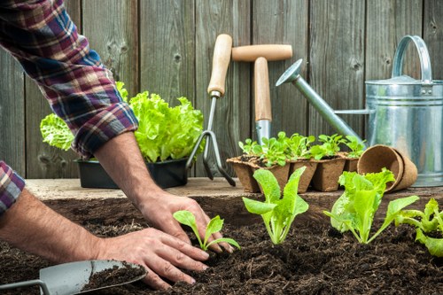 Gardeners preparing equipment safely before maintenance work