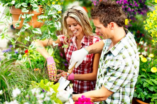 Crouch End gardeners estimating clearance costs for a family garden