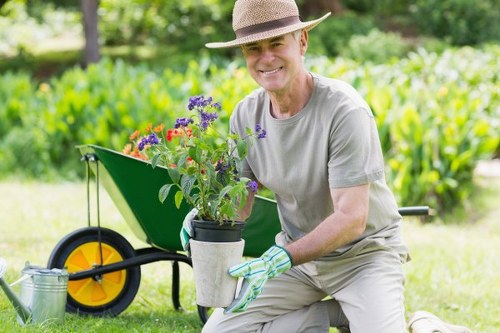 Local gardeners maintaining a healthy garden border in Crouch End